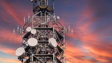 mobile phone antennas at sunset.