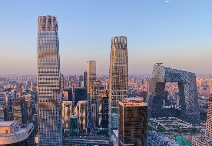 Beijing skyline at dusk. Modern skyscrapers define the cityscape. A vibrant journey for LGBTQ+ travel in Beijing, China.