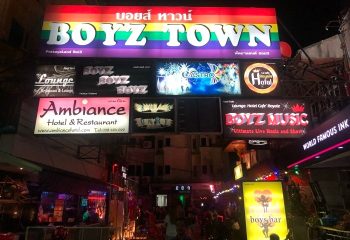 BoyzTown, Gay Pattaya nightlife. Street view of Boyz Town's vibrant signs for bars, hotels, and lounges. A popular gay destination in Thailand.