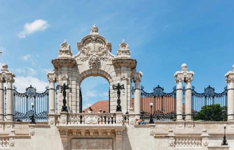 Ornate gate in Buda, Budapest. A walking tour reveals iconic views, hot spots, and culture. A must-see for gay travelers.