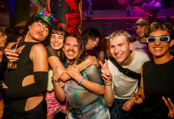 Burdekin Hotel Sydney: Gay travelers enjoy a night out at a party. People are smiling, posing, and having fun. Nightlife scene.