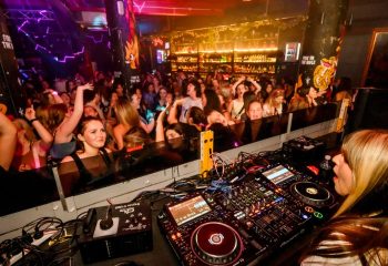 Burdekin Hotel Sydney: DJ spins for a packed, energetic crowd. Popular gay bar known for its vibrant nightlife and inclusive atmosphere.