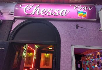 Chessa Bar entrance in Torremolinos, Spain. Gay bar with rainbow flag. Nightlife destination for gay men, part of gay travel advice.