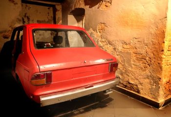Coxx Men's Bar Budapest: Red car inside the gay bar. Unique interior design and travel advice for gay men visiting Budapest.