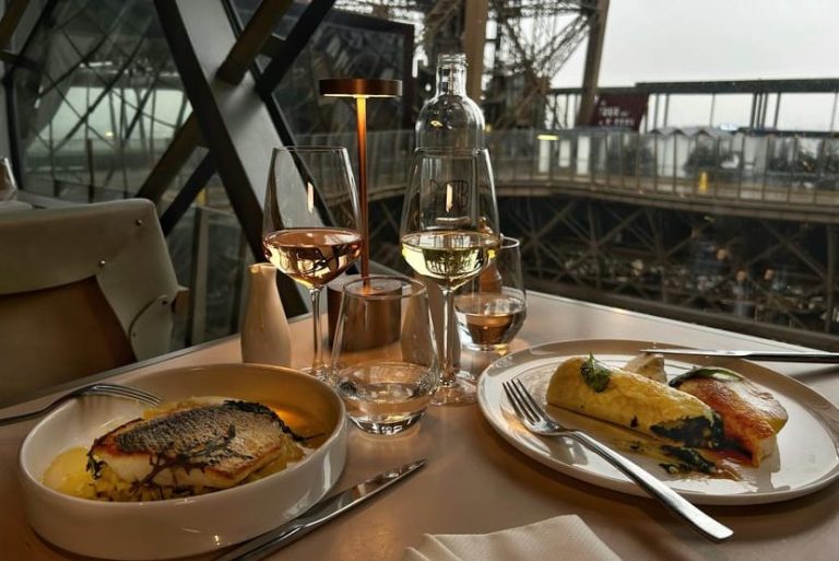 Eiffel Tower dining: Madame Brasserie dinner, drinks. Stunning views of Paris. Romantic gay travel destination. Fine dining, French cuisine.