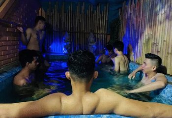 Elegantz Spa Sauna & Gym Bali: Gay sauna in Seminyak. Men relaxing in a pool with blue lighting. Best sauna in Bali's gayborhood.