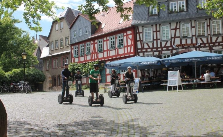 Frankfurt Green Escape: Segway tour through parks and gardens. Group on Segways in a historic square, enjoying a unique & fun way to explore.