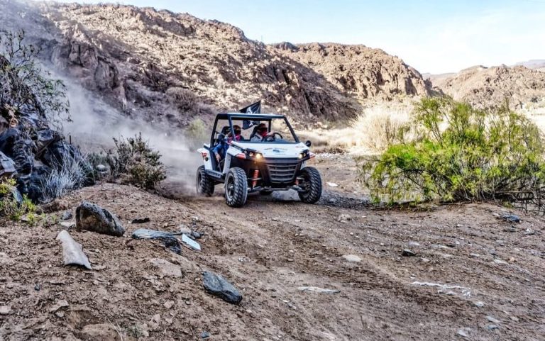 Gran Canaria gay-friendly buggy tour. Adventure in the wild south. Buggy driving through rugged terrain. Outdoor activity.