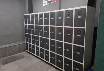 Lockers at H2O Sauna, a gay sauna in Benidorm. The lockers are grey with white trim, providing secure storage for belongings.
