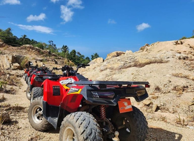 Gay-friendly Ko Pha Ngan ATV adventure. A line of red ATVs ready for a jungle thrill ride. Explore Thailand's nature on this tour.