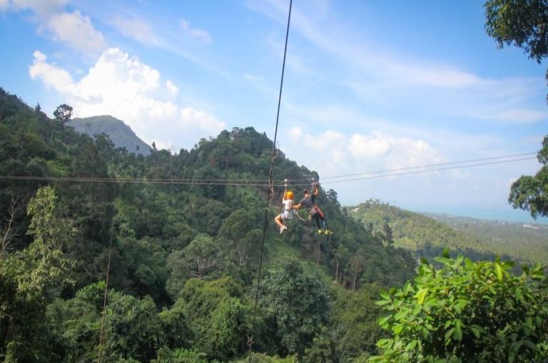 Koh Samui tree bridge zipline adventure. Gay travel in Thailand: Ziplining through the jungle canopy. Fun activity for gay men.