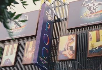 Paradise Massage in Phnom Penh. Exterior view of gay massage parlor with signage and images of men receiving massages. Gay travel advice.