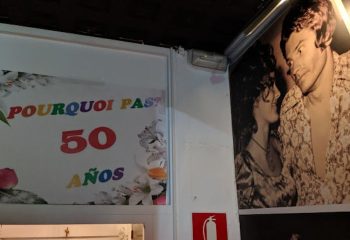 Pourquoi Pas? Gay Bar in Torremolinos, Spain. Celebrating 50 años. Vintage photo of a couple. Gay travel destination.