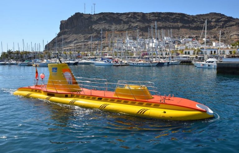 Puerto de Mogan submarine tour adventure in Gran Canaria. Yellow submarine for gay men travel, under the Atlantic ocean.