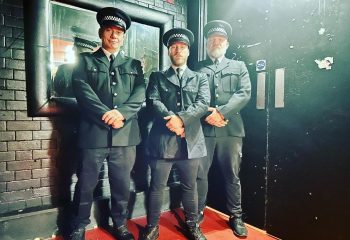 Three men in police uniforms at SBN & NBN Sunday, a London gay club night at Union Vauxhall. Busiest naked party. Gay travel advice.