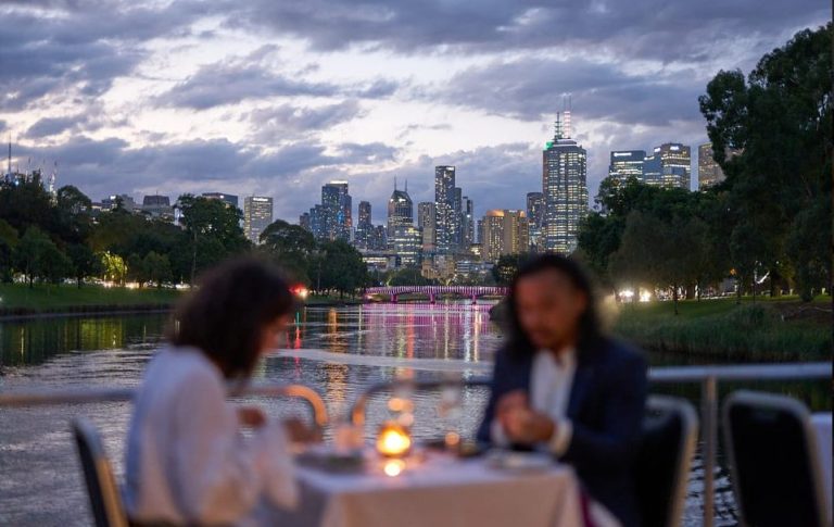 Romantic Melbourne dinner cruise for gay travelers. City skyline view from the Yarra River. Luxe eats, hot drinks, & unique views.
