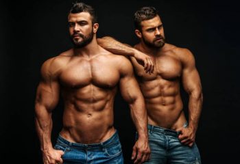 Two muscular gay men in jeans. Tantric Soul Gay Massage London, gay massage spa.