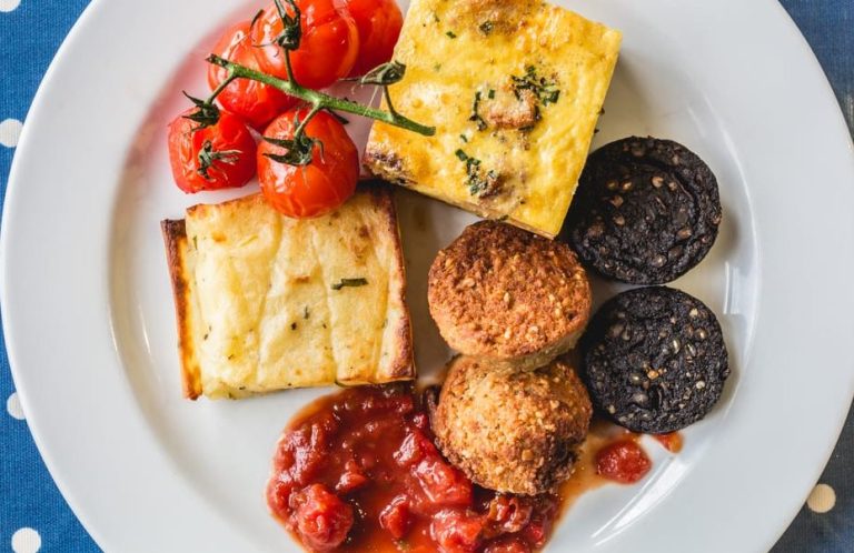 Dublin foodie tour: Plate of Irish food delights. Includes tomatoes, frittata, potato cake, tomato relish, and black pudding.