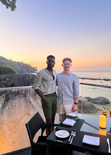 Gay couple Jay and Oliver at Amari Phuket, Thailand. Enjoying sunset dinner during 10 days exploring Phuket's gay beaches.