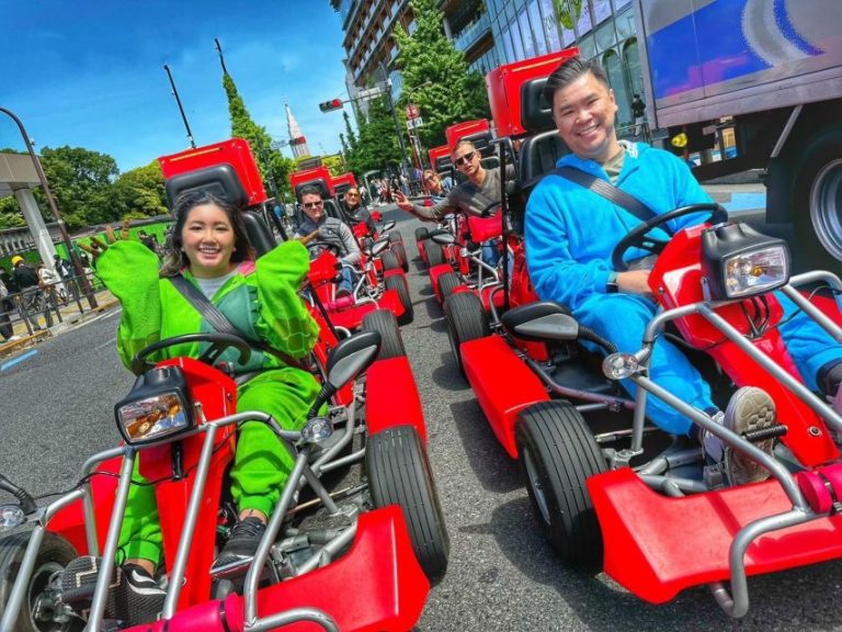 Gay travelers on a Tokyo tour, riding go-karts in costume. Fun, unique experience. Tokyo-Tour.jpg captures the excitement.