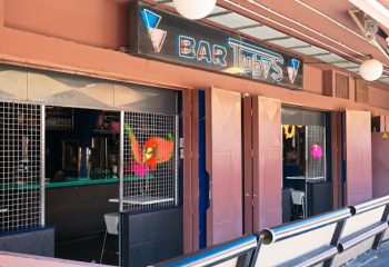 Tubos Gay Bar in Gran Canaria. Exterior view of the bar Tubos, a popular gay club, with its sign and entrance. Gay travel advice.