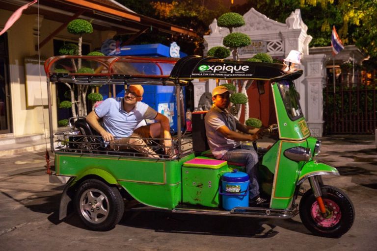 Gay traveler on a Bangkok Tuk-Tuk Tour at night. Explore temples, markets, and food. Experience Thailand's vibrant culture. #Bangkok #GayTravel