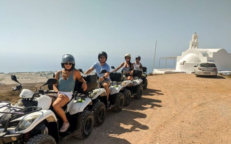 Gay travelers on a Santorini ATV quad bike tour. Beach, sun, cocktails, and adventure. Explore the island's beauty on a wild ATV tour.
