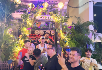 Space Hair Salon and Bar in Phnom Penh. Gay bar entrance with men posing. Gay travel advice for Cambodia's capital city. Nightlife.